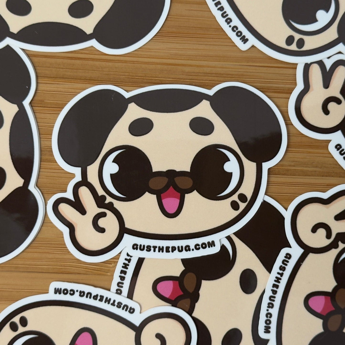 Cartoon dog stickers with a brand name on a wooden surface