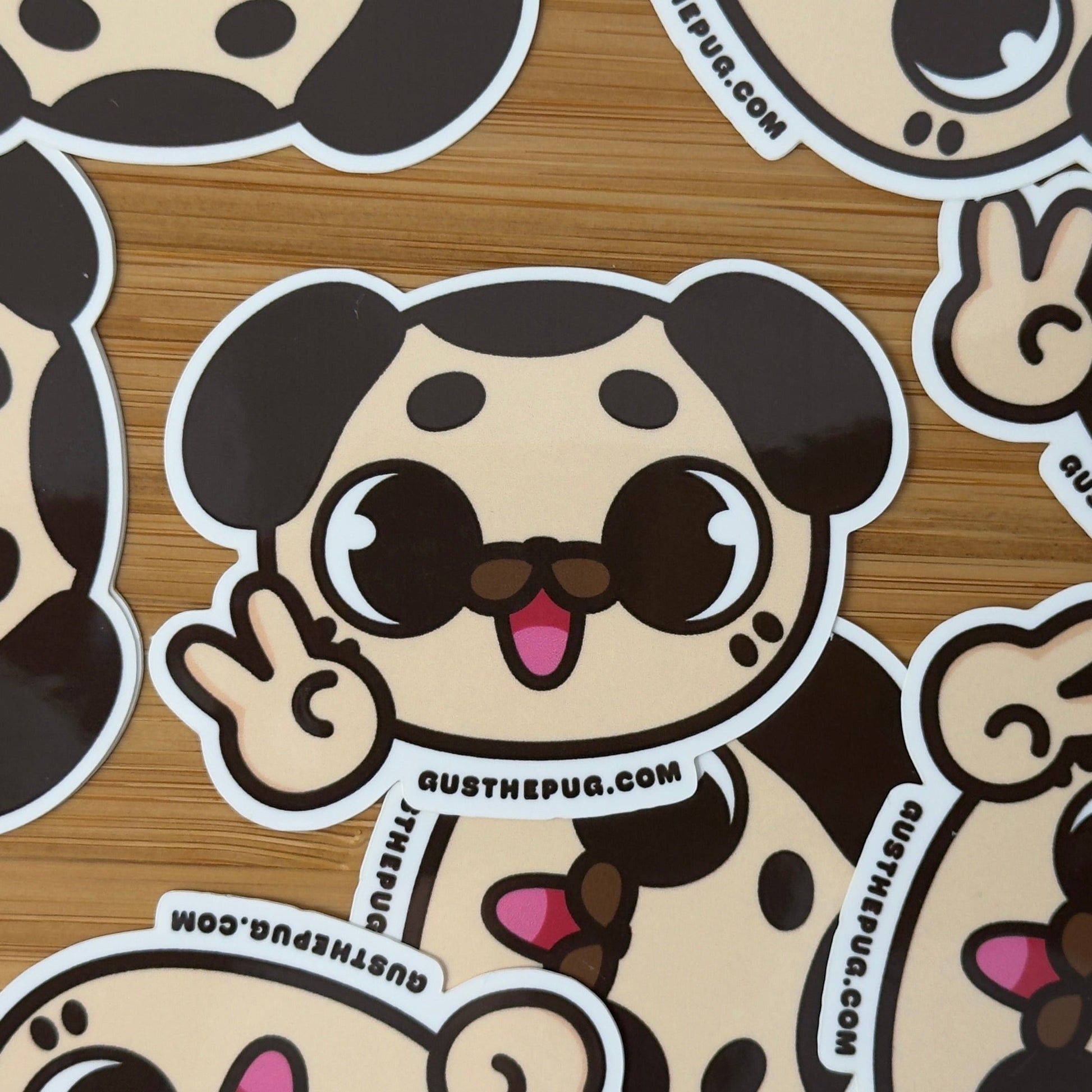 Cartoon dog stickers with a brand name on a wooden surface