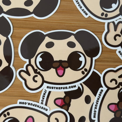 Cartoon dog stickers with a brand name on a wooden surface