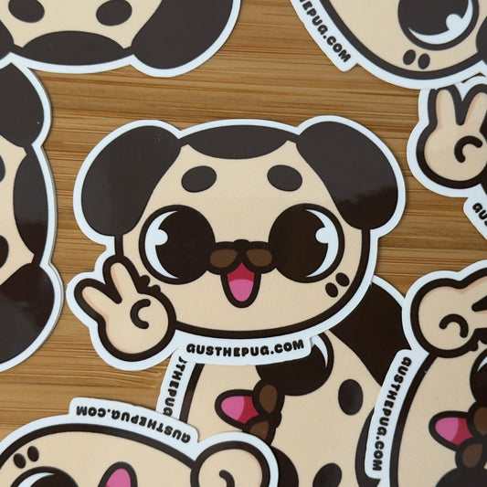 Cartoon dog stickers with a brand name on a wooden surface